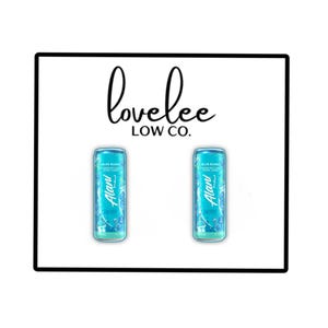 May include: Two identical light blue Alani Nu energy drink cans labeled Blue Slush with white text and graphics, positioned below the black text logo lovelee LOW CO. The cans feature a slim cylindrical shape with a metallic finish and branding.