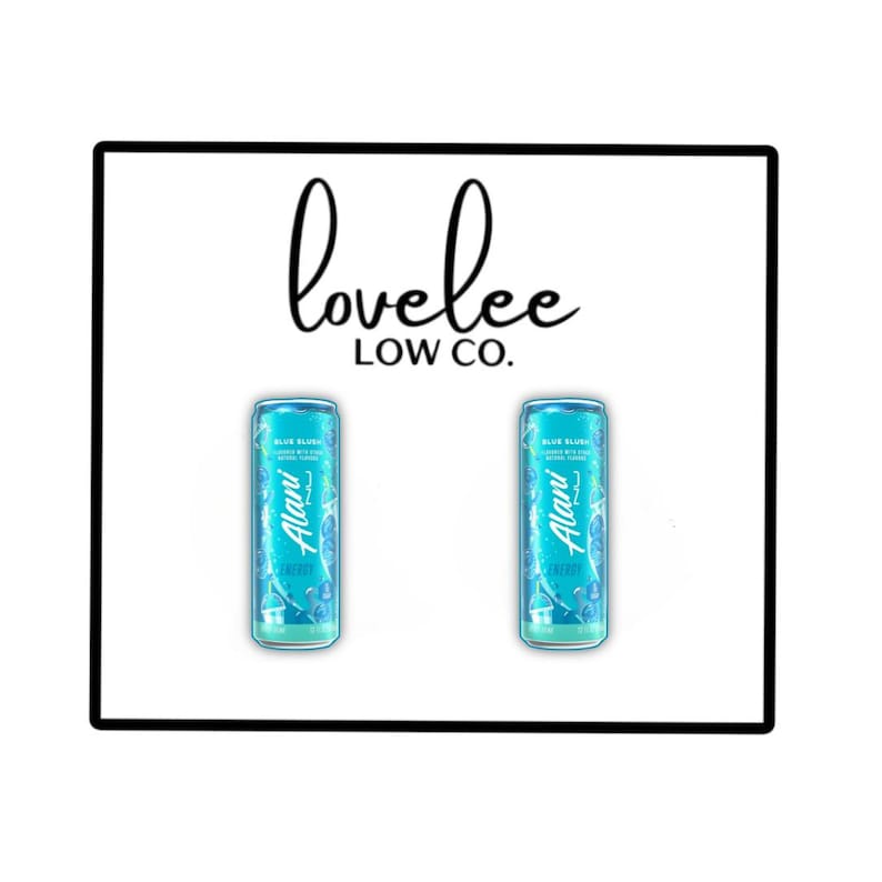 May include: Two identical light blue Alani Nu energy drink cans labeled Blue Slush with white text and graphics, positioned below the black text logo lovelee LOW CO. The cans feature a slim cylindrical shape with a metallic finish and branding.