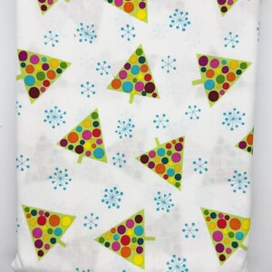 May include: White fabric with a repeating pattern of colorful Christmas trees and blue snowflakes. The trees are green with multi-colored polka dots. The snowflakes are light blue.