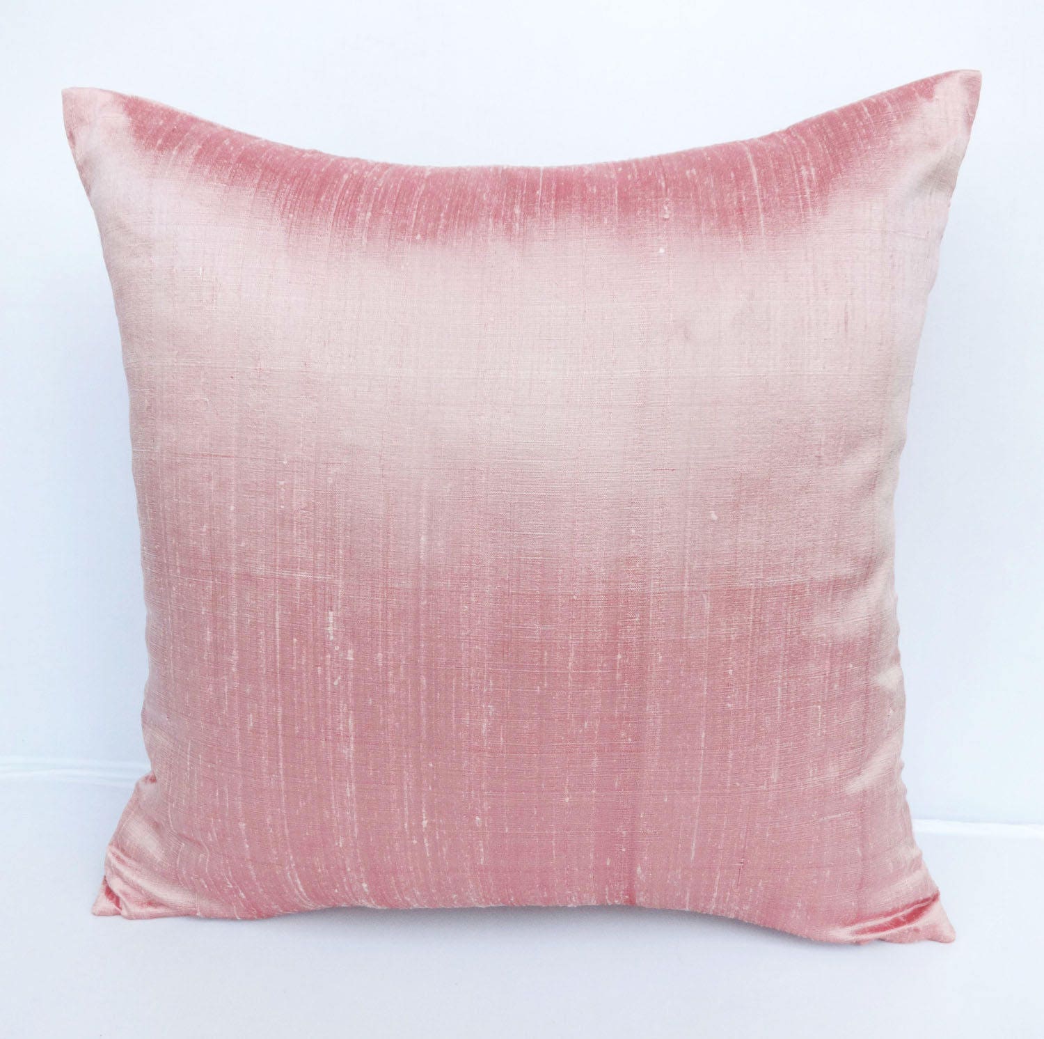 small pink throw pillow