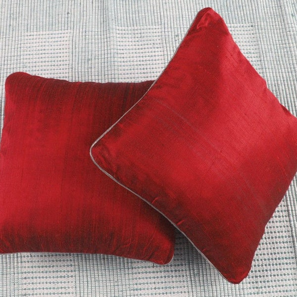 red dupioni silk pillows.  decorative cushion cover. custom made avialable in range of colours. With silver or gold paiping cord.