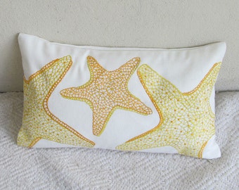 On offer. Starfish pillow orange and yellow starfish on  white cushion cover. Beach decor.  Nautical pillow. 12X20 inches on 20% discount