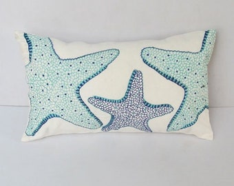 Aqua blue and Cobalt blue star fish pillow on  off white  decorative sea theme pillow.  Nautical inspired pillow cover.  Custom  made.
