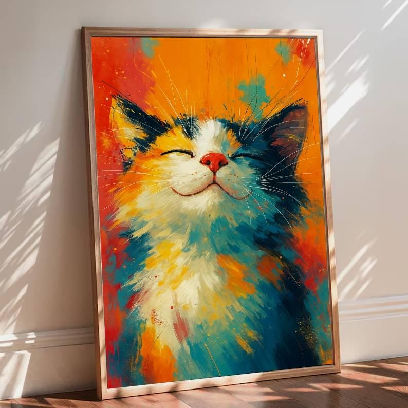 May include: A framed art print of a smiling cat with closed eyes. The cat's fur is a mix of white, orange, blue, and black, with a red nose. The background is a vibrant blend of orange, red, and blue brushstrokes.