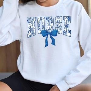 Toile De Jouy Nurse Bow Sweatshirt, Coquette Nurse Shirt, Gift For Nurse, Nurse Ribbon Hoodie, Registered Nurse Shirt, Floral Nurse Hoodie