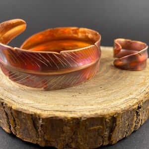 Pulsera y anillo de cobre con forma de ala y pluma