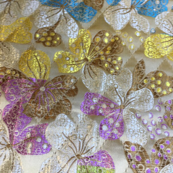 Quilted fabric. sparkling flowers and butterflies. solid  shiny on the other side