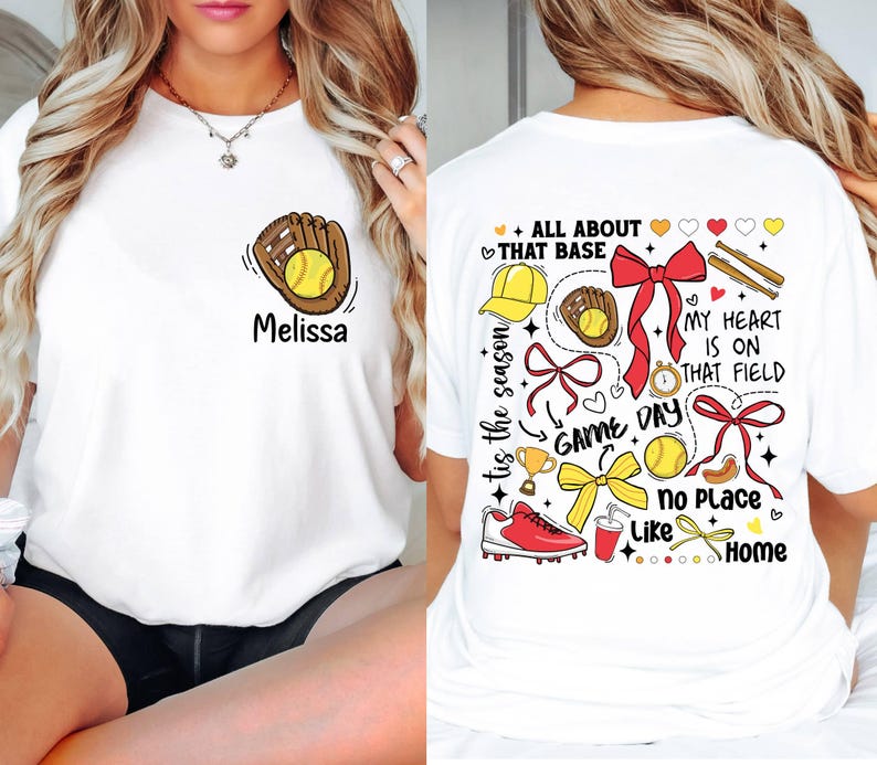 May include: White t-shirt with a softball design on the front and a colorful softball design on the back. The back design includes the text "All About That Base", "Game Day", "My Heart Is On That Field", and "No Place Like Home".