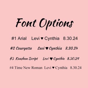May include: A list of four font options for a personalized design. The options are Arial, Courgette, Kaushan Script, and Time New Roman. The text "Levi &hearts; Cynthia 8.30.24" appears next to each font option.