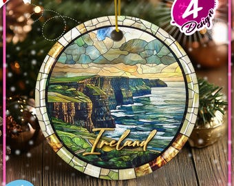 May include: A round Christmas ornament featuring a stained glass style image of the Cliffs of Moher in Ireland. The ornament is white with a gold trim and the word "Ireland" is written in cursive at the bottom.