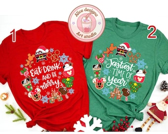 May include: Two Christmas themed t-shirts with a red and green color scheme. The red shirt has the text "Eat Drink and Be Merry" with a Mickey Mouse head and other Christmas themed graphics. The green shirt has the text "Jastiest Time of Year" with a Mickey Mouse head and other Christmas themed graphics.