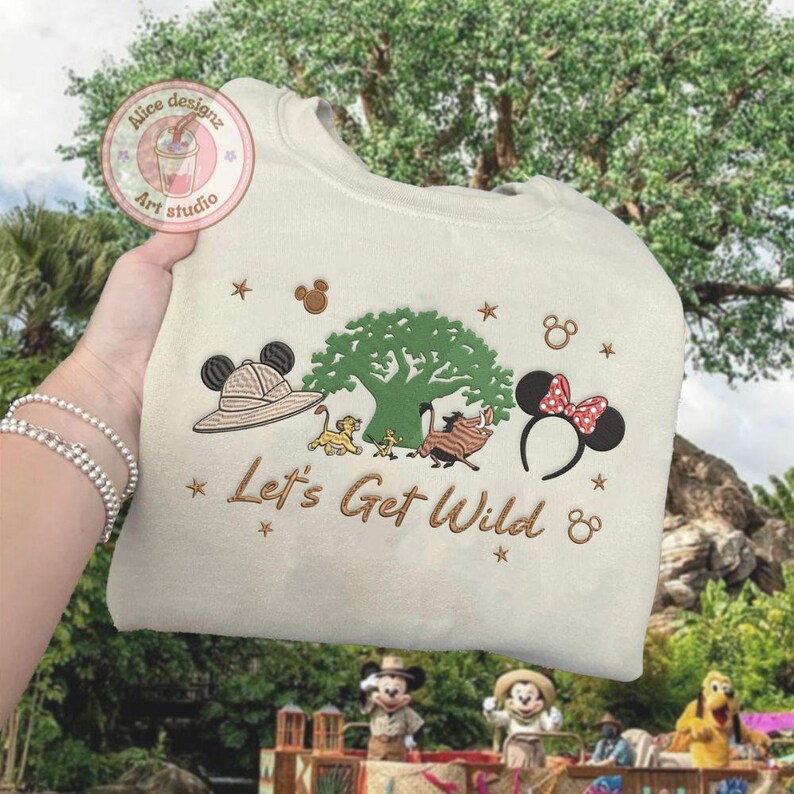 May include: A white ceramic mug with a black handle and the text "But first, coffee" in a handwritten style. The mug is on a white surface. The mug is likely for hot beverages.