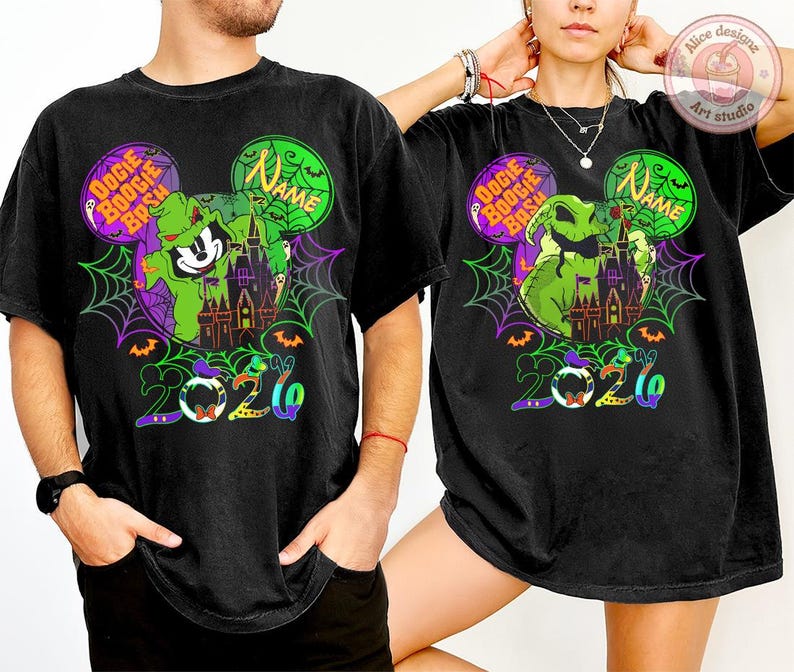 May include: Black t-shirts with a colorful graphic design featuring a green character, a haunted castle, and the text "Oogie Boogie Bash" and "2020". The design is set within Mickey Mouse ears.