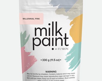 May include: A pouch of Millennial Pink milk paint by Fusion. The pouch is white with a pink, orange, and blue abstract design. The pouch contains 11.5 ounces of paint.