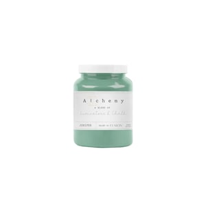 May include: A teal-colored paint jar with a white lid. The label reads "Alchemy, A blend of Limestone & Chalk, Juniper, Paint by Fusion". The jar is filled with a light teal paint, perfect for home decor and craft projects.