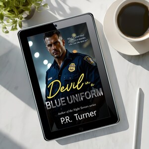 May include: A digital tablet displaying the book cover of "Devil in a Blue Uniform" by P.R. Turner. The cover features a man in a police uniform. The title is in yellow script. A cup of coffee and a plant are in the background.