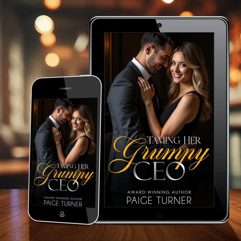 May include: A smartphone and tablet display the cover of a romance novel titled "Taming Her Grumpy CEO" by Paige Turner. The cover features a man in a suit embracing a woman in a black dress. The background is blurred.