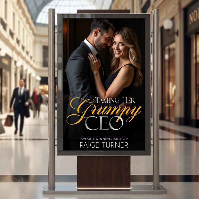 May include: An outdoor advertising display features a book cover with a man and woman embracing. The title, "Taming Her Grumpy CEO," is in gold script. The author's name, Paige Turner, is also displayed.