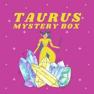 May include: A yellow and blue illustration of a Taurus zodiac sign with a woman standing on top of a pile of crystals. The text "Taurus Mystery Box" is above the illustration.