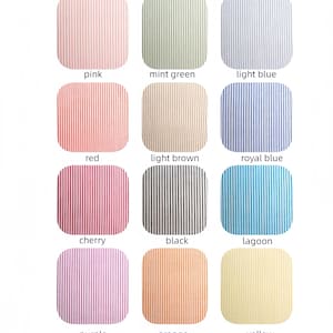 May include: A grid of twelve fabric swatches featuring 2mm stripes in various colors: pink, mint green, light blue, red, light brown, royal blue, cherry, black, lagoon, purple, orange, and yellow. Each swatch is labeled with its color name.