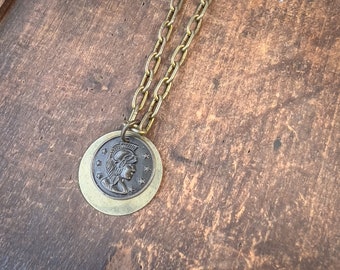 Roman Coin and Round Brass Layering Necklace on Cuckoo Clock Chain