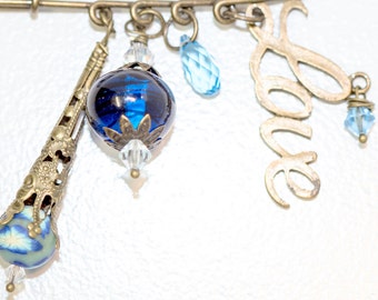 Love is Blue Pin with Blown Glass Bead, Love Charm, Swarovski Faceted Drop, Polymer Clay Bead, and Antique Bronze Accents