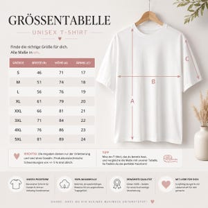 May include: A white unisex t-shirt displayed on a wooden hanger, accompanied by a size chart titled GR&Ouml;SSENTABELLE UNISEX T-SHIRT. The chart lists sizes S through 5XL with corresponding width, height, and sleeve measurements in centimeters.