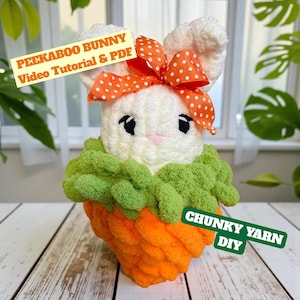 May include: A white ceramic mug with a black handle and the text "But First, Coffee" in a bold, black font. The mug is set against a blurred background, suggesting a cozy setting.