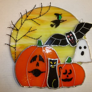 stained glass halloween moon with pumpkins, bat, witch,ghost