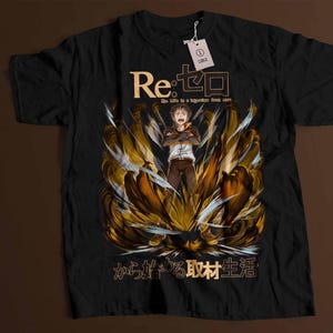 May include: Black t-shirt featuring a gold and white graphic of a character from the anime "Re:ZERO - Starting Life in Another World". The text "Re:ゼロ" and "から始める異世界生活" is printed on the shirt.