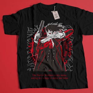 May include: Black t-shirt with a red and white illustration of a vampire holding a gun. The text "The bird of Hermes is my name, eating my wings to make me tame" is printed on the bottom of the shirt.