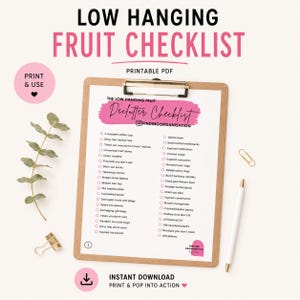 May include: A printable PDF checklist titled LOW HANGING FRUIT CHECKLIST on a clipboard. The document features a pink brush stroke header with the text Declutter Checklist and a two-column list of items to discard, including old lip balm and socks.