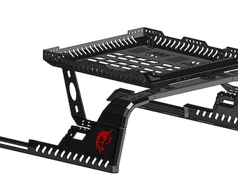 May include: Black metal truck bed rack with a red logo. The rack has a mesh design and is designed to be mounted on a truck bed.