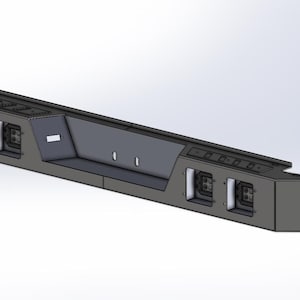 Peut inclure: Un pare-chocs de camion en métal gris avec des feux intégrés et une section centrale en retrait. Le pare-chocs a une forme rectangulaire avec des bords angulaires, conçu pour la protection et la fonctionnalité du véhicule.