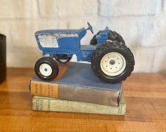 Vintage chippy metal tractor, blue tractor