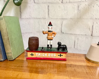 Vintage gietijzeren muntbank, hond springt door de ring, AS IS