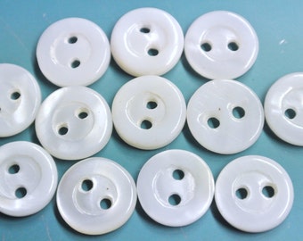 Lot of 100 unused small vintage 1940s white natural organic mop/mother of pearl buttons with 2 holes