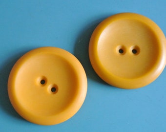 Lot of 4 large vintage 1960s unused mustard yellow plastic buttons with 2 holes for your sewing prodjects