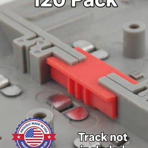 May include: Close-up of a gray plastic component with a red insert. The text "120 Pack" is at the top, and "Track not included" is at the bottom. A "Proudly Made in USA" emblem is also visible.