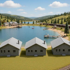May include: Three miniature gray houses with white roofs and chimneys sit on a green surface. A lake, trees, and a train in the background create a scenic landscape. The houses have windows and doors.