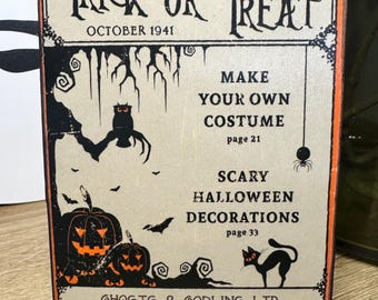 May include: Vintage Halloween sign with orange and black accents. The sign reads "Trick or Treat" and "October 1941." It features illustrations of pumpkins, bats, an owl, and a black cat. The sign also includes text about costumes and decorations.