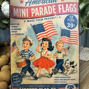 May include: Vintage-style sign for "American Mini Parade Flags." The sign features illustrations of children marching with American flags, a drum, and a trumpet. Text includes "Wave Them Proudly!" and "Liberty Flag Co." Made in the U.S.A.