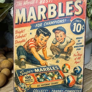 May include: Vintage-style wooden sign featuring the text "The World's Best Marbles" with illustrations of children playing marbles. The sign includes the text "Super Marbles" and "100 Marbles in Each Box!" with colorful marbles.