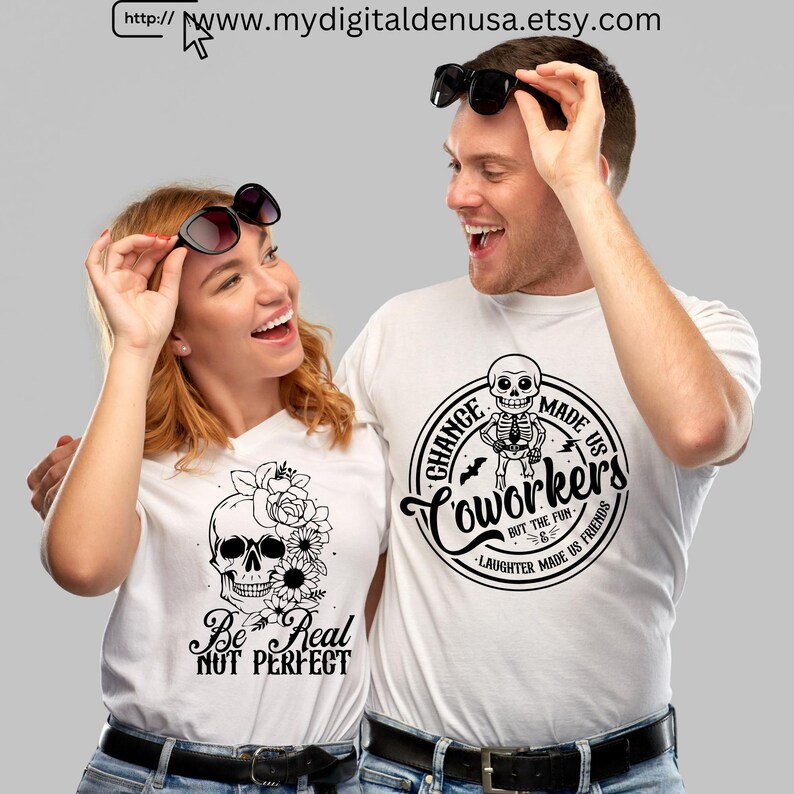 May include: Two people wearing white t-shirts with graphic designs. One shirt features a skull with flowers and the text "Be Real Not Perfect." The other shirt has a skeleton and the text "Coworkers but the fun, laughter made us friends."