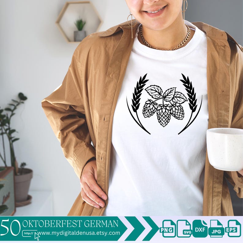 以下が含まれることがあります： ホップの花の輪の黒いグラフィックが描かれた白いTシャツ。シャツの下部には「50 Oktoberfest German」というテキストとウェブサイトのアドレスが記載されています。
