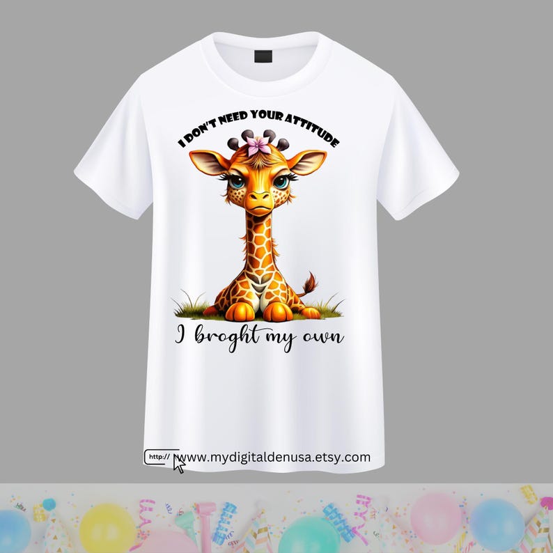 May include: White t-shirt with a cartoon giraffe wearing a pink flower. The giraffe is sitting down and the text "I don't need your attitude I brought my own" is printed on the shirt.