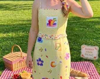 Vintage fruit- en bloemenjurk mouwloos geel maxi damesmaat medium VS gemaakt, geschat begin jaren 90.