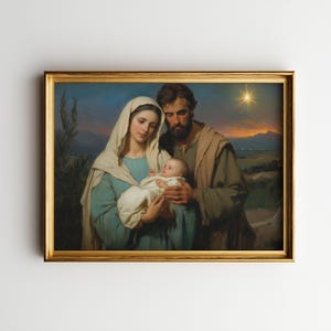May include: A framed painting depicting a religious scene. The artwork features a woman in a blue dress and white head covering holding a baby, with a man in brown robes beside them. A golden star shines in the background.