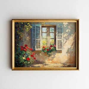 May include: A framed painting depicts a sunlit window with open blue shutters. Red roses and other flowers bloom in window boxes and along the wall. The artwork is in a gold frame, showcasing a serene, impressionistic scene.