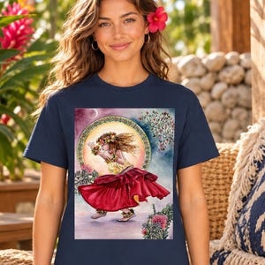 May include: A navy blue t-shirt featuring a rectangular graphic print of a person dancing in a long red skirt, a yellow top, and a floral crown. The illustration includes a circular decorative border, a crescent moon, and various tropical flowers.